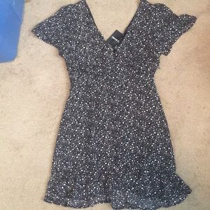 Ruched black and white print ruffled mini dress